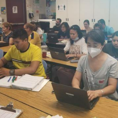 Students practicing computer skills